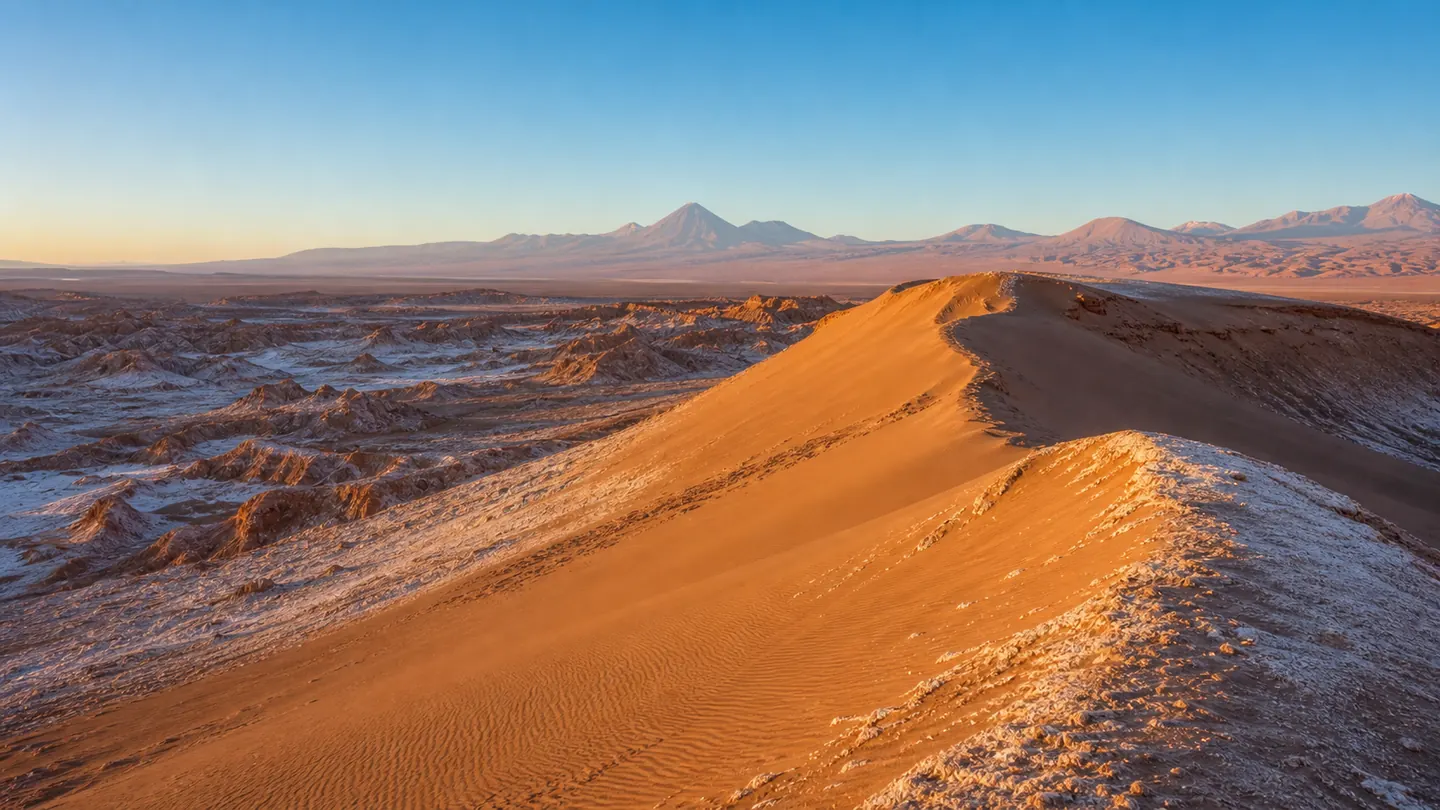 Dune curve and salt deposits in Valle de la Luna during late afternoon light